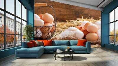 basket of colorful fresh eggs on wooden table Wall mural