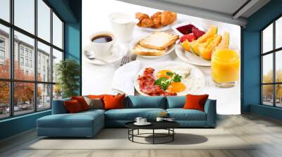 Breakfast with fried eggs, coffee,  juice, croissant and fruits Wall mural