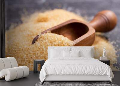 brown cane sugar in a wooden scoop Wall mural