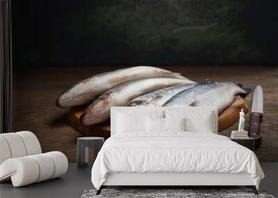 fresh fish are ready for cooking on a wooden table Wall mural