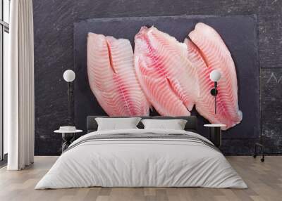 fresh fish fillet on dark board Wall mural