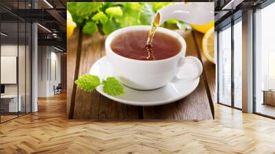 pouring tea into a cup Wall mural