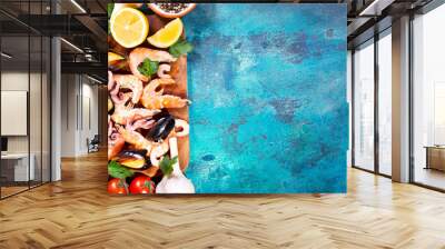 seafood with fresh vegetables on blue background Wall mural