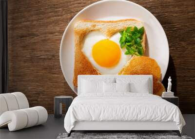 Valentines day.  Breakfast with fried egg and toasted bread shapped heart, top view Wall mural