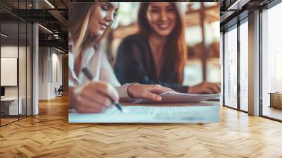 Two business women discussing for financial planing at workspace in minimal office Wall mural