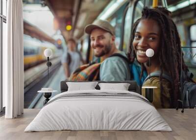 multi-ethnic young couple backpacking at a train station Wall mural