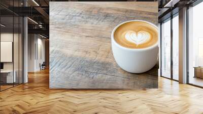 Close up hot cappuccino white coffee cup with heart shape latte art on dark brown old wood table at cafe,food and drink concept  Wall mural