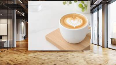 Close up white coffee cup with heart shape latte art on wood tab Wall mural