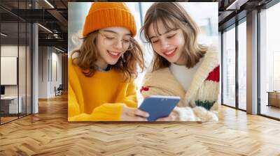 LGBT Multiethnic diverse homosexual lesbian couple spending happy time together with digital tablet  Wall mural