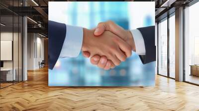 Successful business partners shaking hands in a corporate office Wall mural