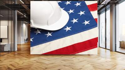 Close up studio shot of a white color construction helmet laying over USA flag Wall mural