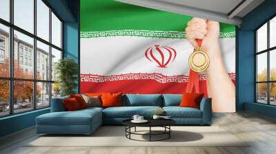 Medal in hand with flag on background - Islamic Republic of Iran Wall mural