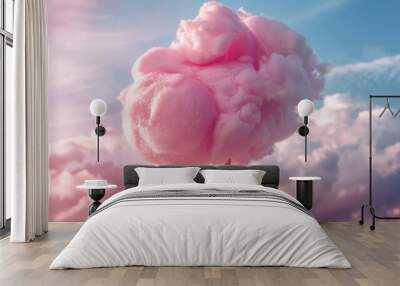 Pink cotton candy against cloudy sky, whimsical confectionery concept Wall mural