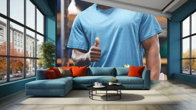 Thumbs up, portrait and fitness man in gym, clipboard and checklist for workout results, progress and like, yes or okay hand. African person, athlete or bodybuilder paperwork and thank you sign Wall mural