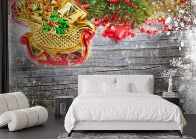 Christmas decoration is a sledges on a snowbound wooden backgrou Wall mural