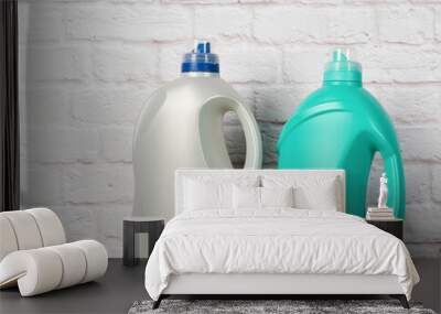 two large plastic bottles with liquid detergent on white brick wall background Wall mural