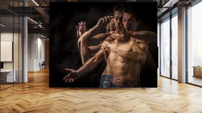 strobo portrait of shirtless wrestler man . black background Wall mural