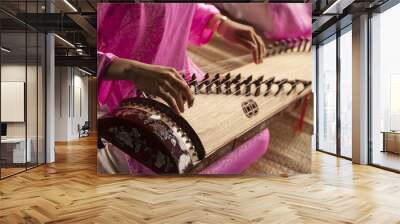 Woman play a traditional korean string instrument : the gayageum Wall mural