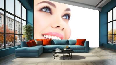 cheerful female with fresh clear skin, white background. Wall mural