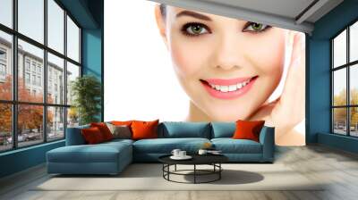 Cheerful female with fresh clear skin, white background Wall mural