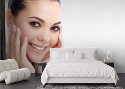 Pretty woman against a grey background with copyspace. Wall mural