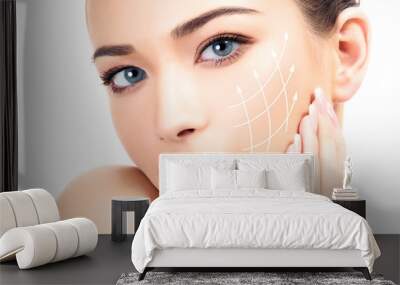 Young female with clean fresh skin, white background Wall mural