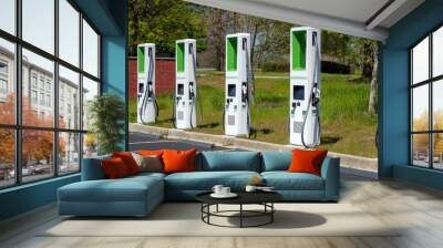 Charging station for electric vehicles in a mall parking lot. Wall mural