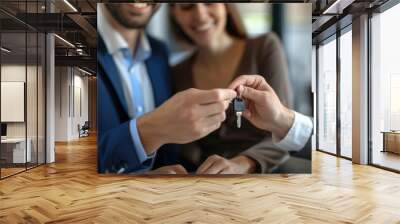 Cropped close up view happy couple receiving keys from new own property, finish meeting in real estate agency lead by realtor in formal suit. Bank mortgage for young family, selling, renting concept Wall mural