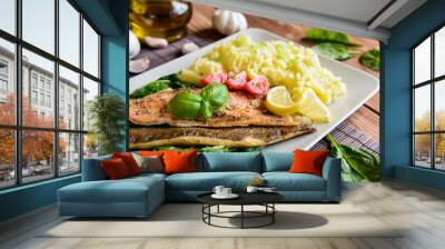 Baked trout fillet with mashed potatoes and steamed spinach Wall mural