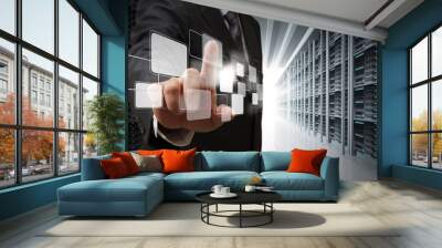 business man point virtual buttons in server room Wall mural