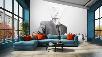 businessman with light bulb head and employees Wall mural