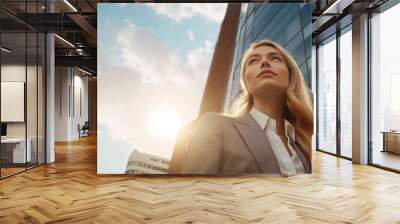 Low-angle  shots of businesswoman front of modern building  Soft light on cloudy days background. Wall mural