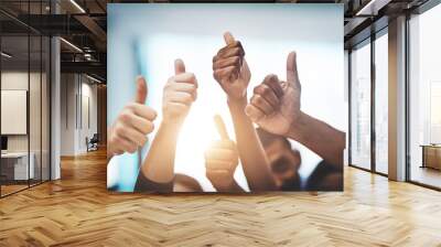 Keep up the amazing work. Cropped shot of a team of colleagues showing thumbs up at work. Wall mural