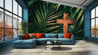 A wooden cross nestled in lush green palm leaves, symbolizing faith and spirituality in nature, Palm Sunday concept. Wall mural