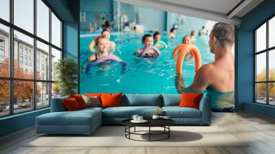 Aqua aerobics, women class with male trainer Wall mural