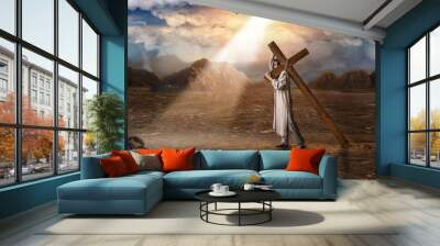 Great martyr with cross in desert, sun rays Wall mural