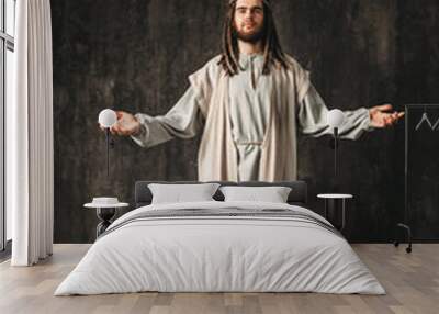 Jesus Christ praying with open arms Wall mural