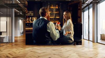 Man and woman having nice conversation at bar counter Wall mural