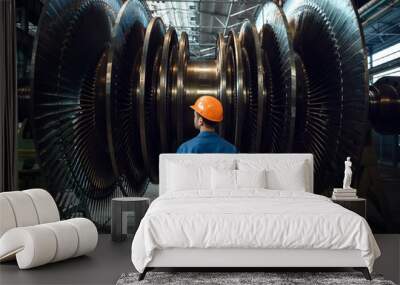 Worker checks turbine impeller vanes on factory Wall mural