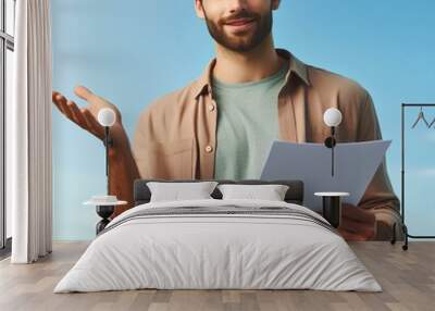 image of a man wearing casual attire showcasing a document with his right hand, man holding a paper  Wall mural