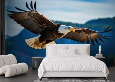 close up of a bald eagle flying in the mountains Wall mural