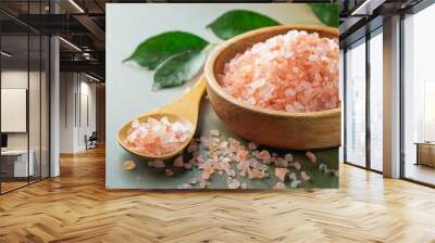 Wooden bowl and scoop with Himalayan pink salt on dark table. ai generated Wall mural