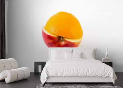 Creative apple combined from red apple and orange half isolated Wall mural