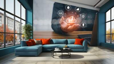 Man uses a laptop with a cloud computing diagram shown on hand. modern working technology, communication on the Internet. Business work and technology concept Wall mural