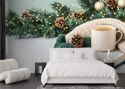 A cozy Christmas morning scene with cup of hot coffee, book, and festive decorations creates warm and inviting atmosphere. Wall mural