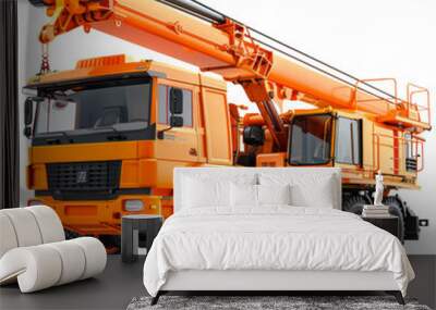 Powerful Construction Crane: A robust orange construction crane, ready for the task. The heavy-duty vehicle is poised for lifting and moving, with its long arm extended and a heavy chain hanging from  Wall mural