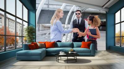 Modern young busines are talking to exchange business experiences in the city center.	 Wall mural