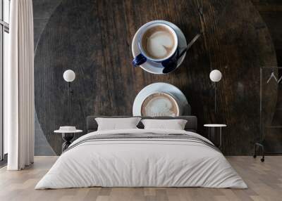 Two cups of latte coffee on a wooden table Wall mural