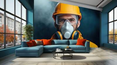 Portrait of a worker wearing protective gear including a gas mask, yellow hard hat, and safety glasses on a smoky industrial background. Wall mural