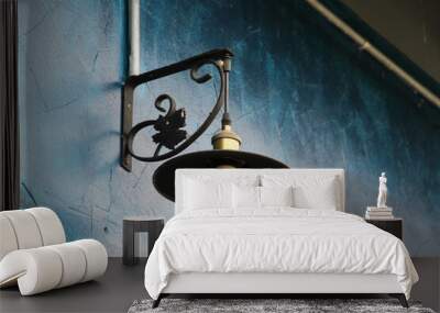 A wall lamp on blue concrete wall Wall mural